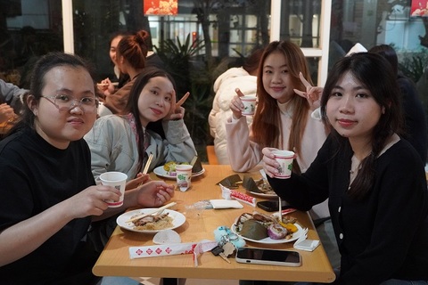 Students take photos together during activity breaks, capturing their smiles and memories of celebrating the Spring Festival at CHU.Image